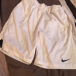 Men’s Dri Fit size M white Nike shorts.